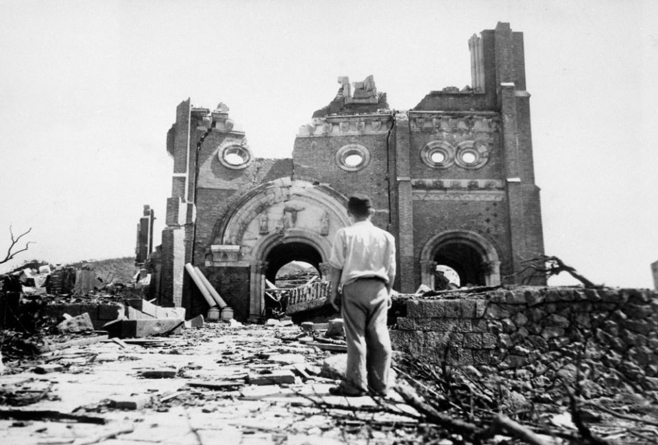 Partial walls of the Urakami Catholic Cathedral in Nagasaki, Japan, stand amid rubble a month after the U.S. detonated an atomic bomb Aug. 9, 1945. (AP/Stanley Troutman)