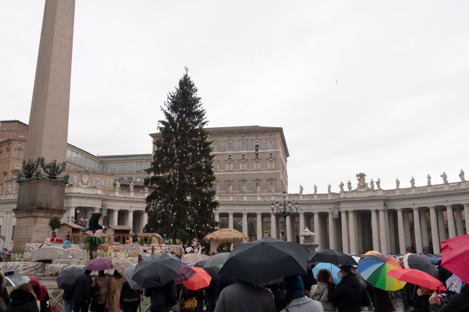 The Christmas tree is seen as Pope Francis leads the Angelus from the window of his studio overlooking St. Peter's Square at the Vatican Jan. 9, 2022. The pope prayed for peace in Kazakhstan. (CNS photo/Vatican Media)