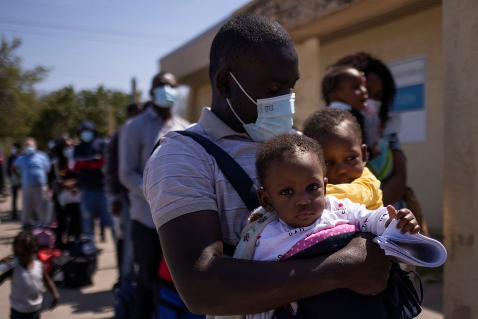 Migrants from Haiti are seen at the Val Verde Border Humanitarian Coalition after being released from U.S. Customs and Border Protection in Del Rio, Texas, March 21, 2021. (CNS photo/Adrees Latif, Reuters)