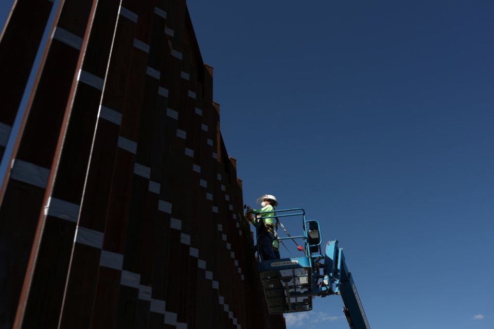 Contractors in Nogales, Ariz., prepare to paint the wall along the U.S.-Mexico border Sept. 13, 2018. (CNS photo/Adrees Latif, Reuters)
