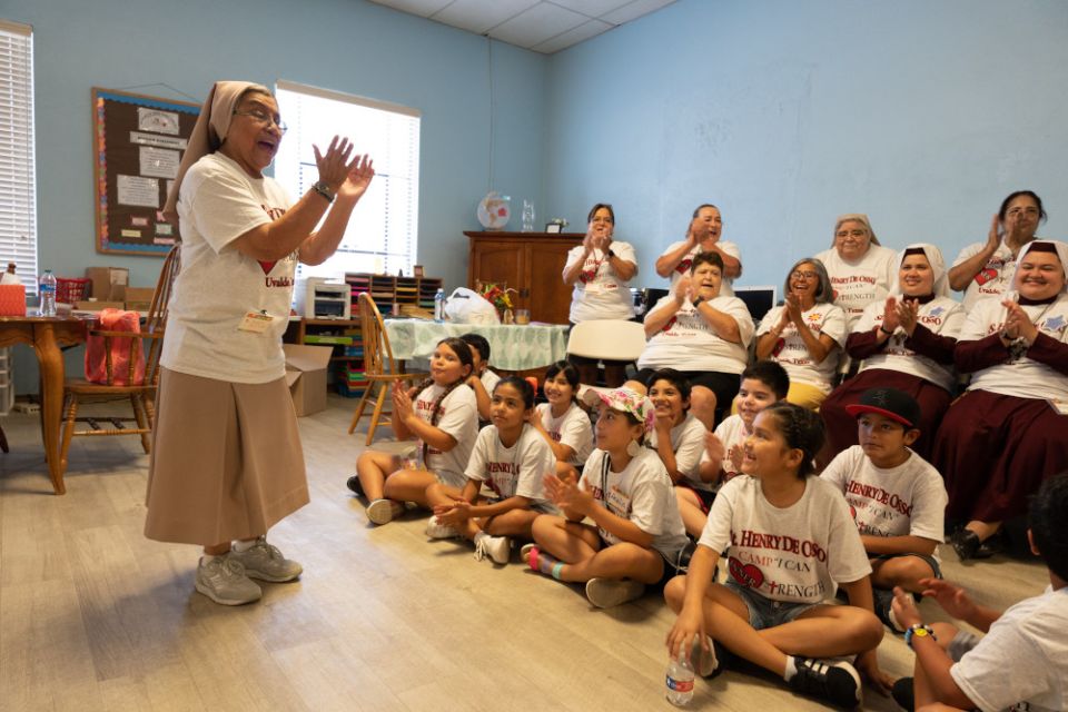 Teresian Sister Dolores Aviles speaks to children attending Camp I-CAN in Uvalde, Texas, July 25, 2022. 