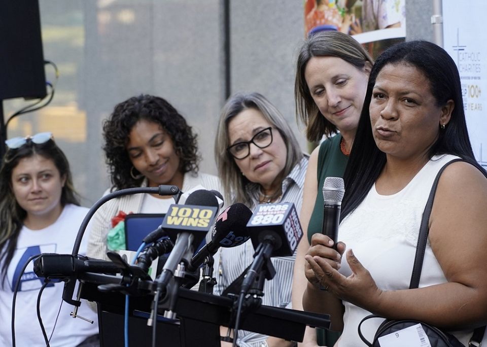 Jennifer, a migrant from Venezuela who is seeking asylum in the U.S., speaks during a news conference outside the Archdiocese of New York's headquarters in New York City Aug. 16, 2022.